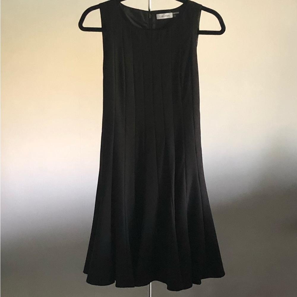 Calvin Klein black, multi-seamed, flared hem dress/jumper. Fully lined.